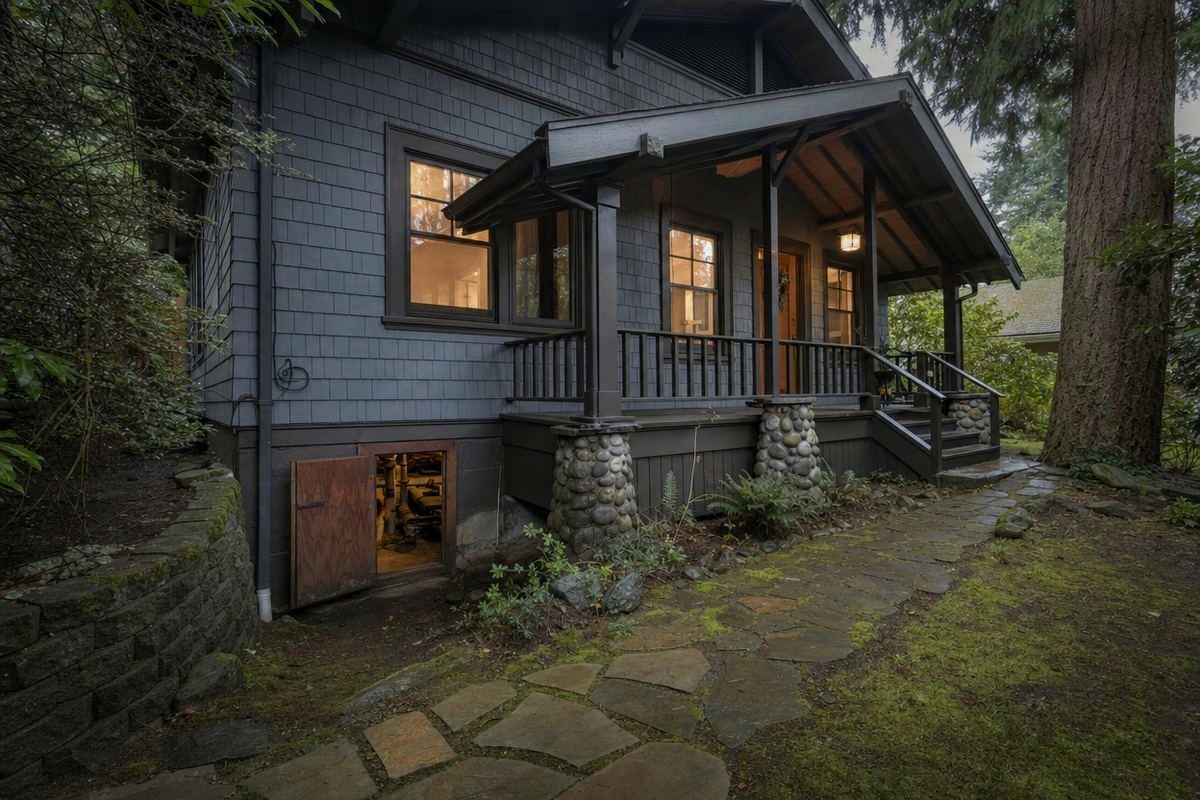 A Washington craftsman house on a raised crawl space foundation among fir trees